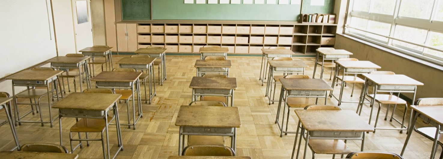 empty classroom with chairs and chalkboards